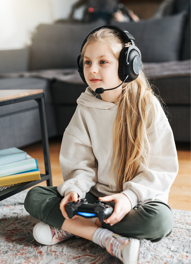 Child playing with a game controller